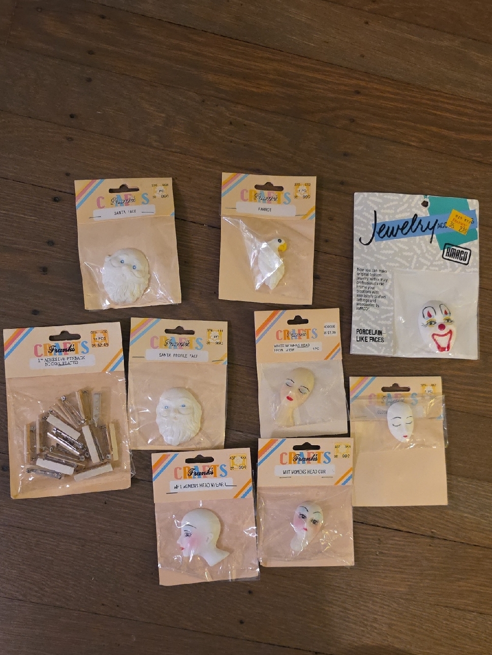 Craft Assorted Face/ Head Embellishments And Pinbacks-- Lot Of 9. NEW
